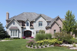 Stone and brick home with arched doorway