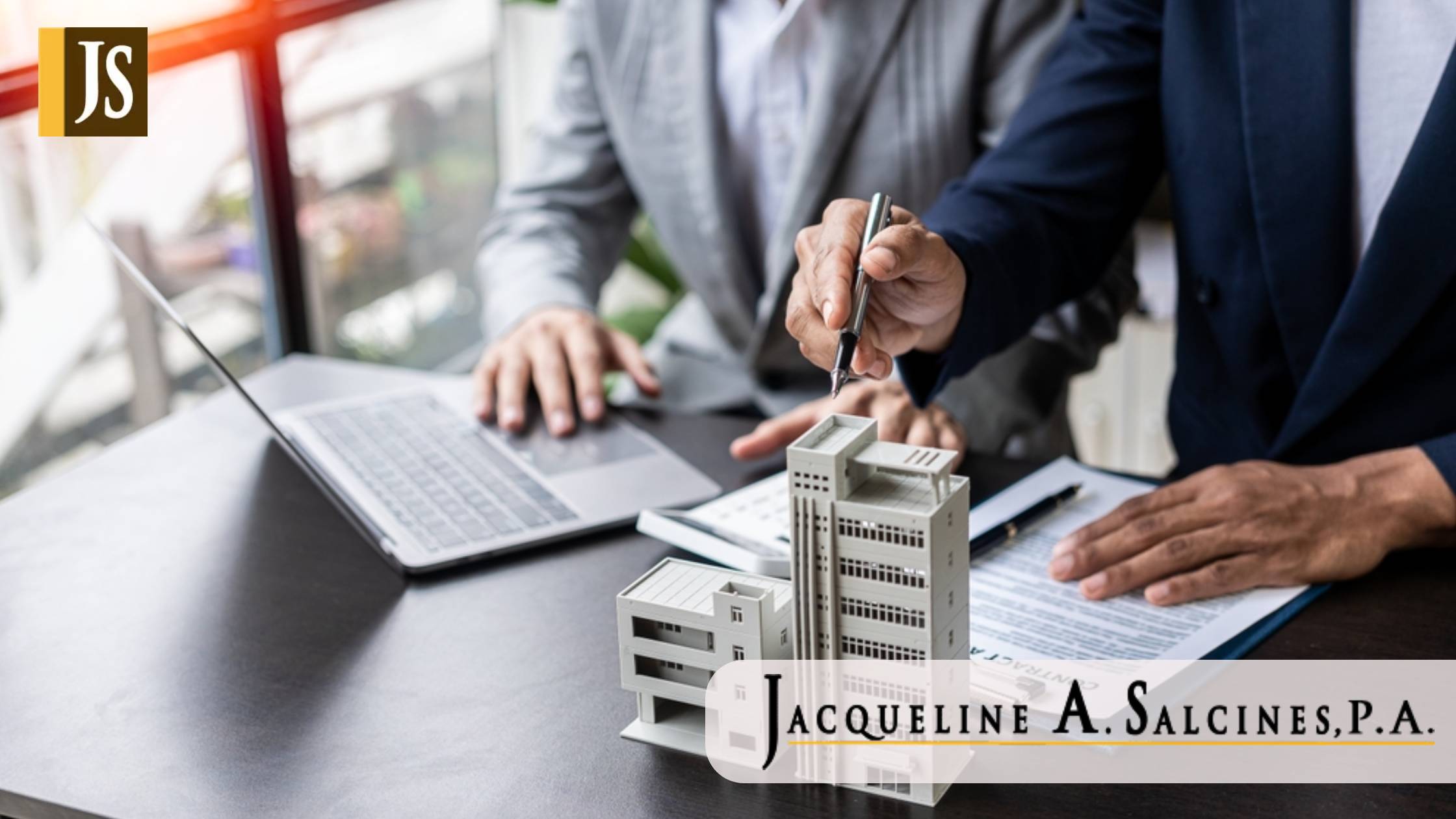 Real estate agents offer contracts to buy or rent housing. Businessman holding model small building house with property insurance at table in home sales office